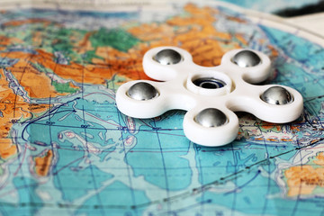 Toy spinner on the map