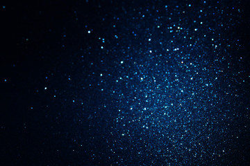 Obraz na płótnie Canvas glitter vintage lights background. blue and black. de focused
