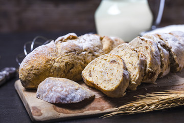 Freshly baked traditional bread on wooden table Oatmeal Bread