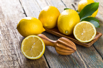 Lemons and squeezer .
