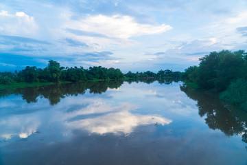 Reflection of river with blue sky, Lamphun, Thailand.