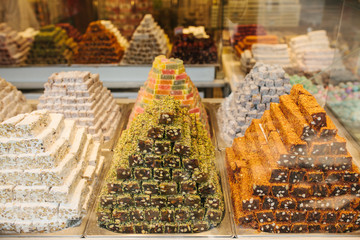 Delicious turkish delight pyramids on display in confectionery shop in Istanbul, Turkey. View...