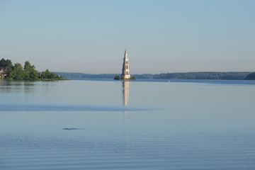 Morning landscape of the Uglich reservoir. A view of an ancient flooded bell tower. Kalyazin, Russia