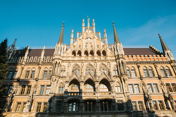Fototapeta na wymiar Town Hall Marienplatz in the central square of Munich, the center of the pedestrian zone and one of the main attractions of the city center. It is considered the heart of Munich. An ancient building.