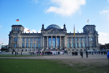 German people and foreigner travelers walk and posing for take photo at front of Reichstag building