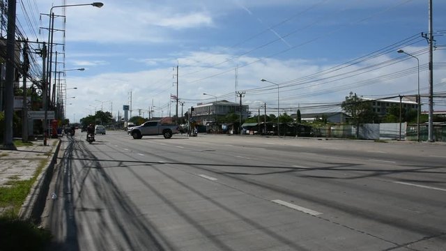 View landscape of traffic road and vehicle drive u-turn at street of Amphoe Phra Samut Chedi on August 9, 2017 in Samut Prakan, Thailand