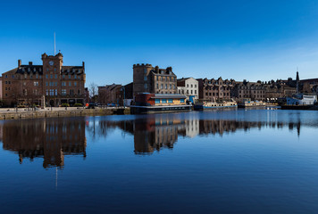 Fototapeta na wymiar Leith shore Edinburgh reflected buildings