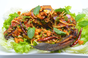 fried snakehead fish serve with herb and spicy sauce