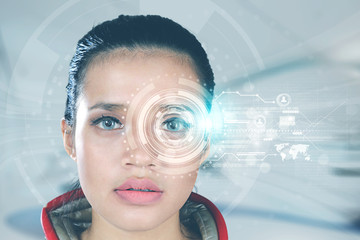 Futuristic woman looking at virtual graphics