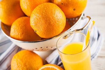 Fresh oranges in a colander