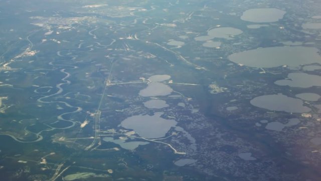 The view from the airplane window on the rivers and lakes.