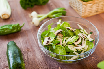vegetable green salad bowl on kitchen table, balanced diet