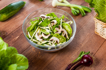 vegetable green salad bowl on kitchen table, balanced diet