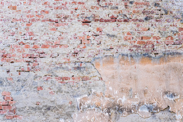 background texture old brick wall with remnants of plasters
