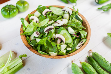 vegetable green salad bowl on kitchen table, balanced diet