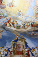 Old religious shows painted on the ceiling of the church