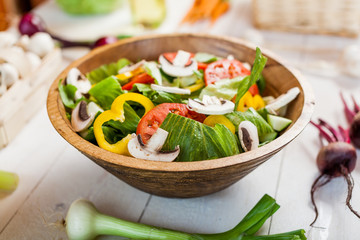 vegetable salad bowl on kitchen table, balanced diet