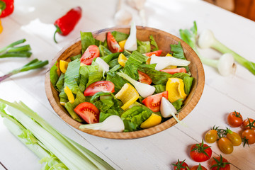 vegetable salad bowl on kitchen table, balanced diet