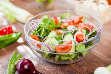 vegetable salad bowl on kitchen table, balanced diet