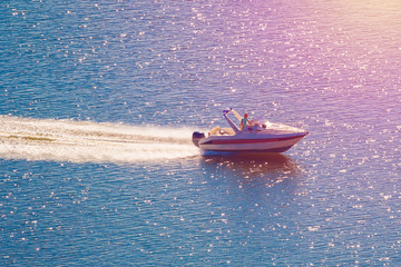 Motor boat on the water (toned)