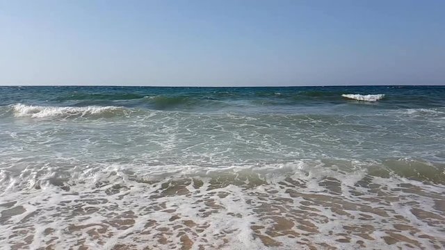 Waves in slow motion on the beach of the Mediterranean Sea in Tunisia
