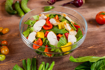 chicken salad bowl on kitchen table, balanced diet