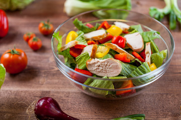 chicken salad bowl on kitchen table, balanced diet