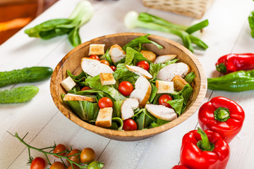 chicken salad bowl on kitchen table, balanced diet
