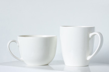 Two white mugs,  clean tea cups mock up