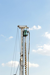 Piling rig isolated against blue sky