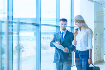 Businesspeople walking in the corridor of an business center