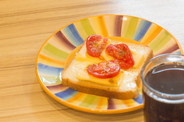 the sandwich on the plate on the table3