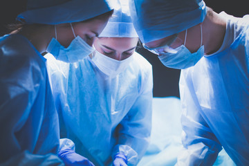 Team surgeon at work in operating room