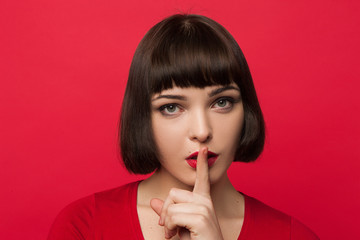 Fototapeta premium Young girl secrets. Silence background. Modern youth gossips, fashion female model