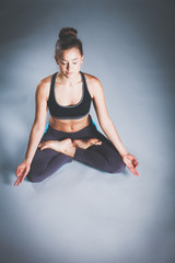 Fototapeta na wymiar Portrait of sport girl doing yoga stretching exercise