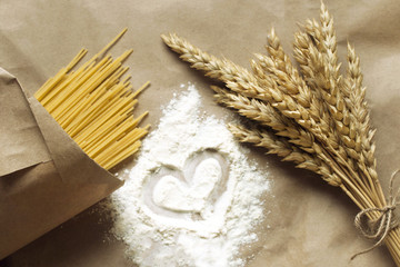 Still life of wheat ears and pasta