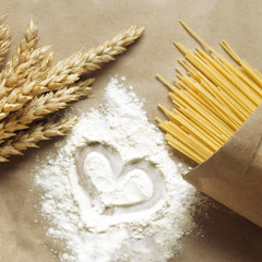 Still life of wheat ears and pasta