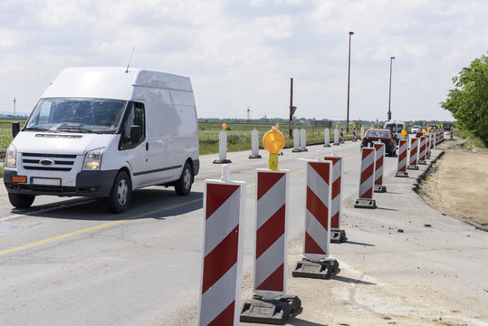 Serious repair of the damaged road and columns of stopped vehicles