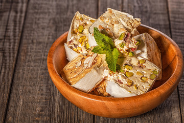 Nougat with honey and nuts, selective focus.