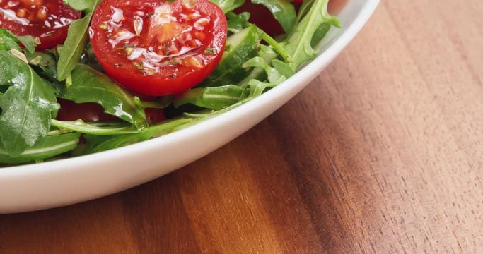 salad from ruccola, cherry tomatoes and cucumber