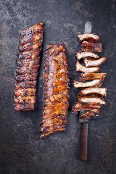 Barbecue pork spare ribs as top view on an old rusty board