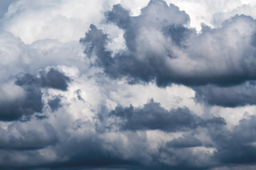 Dark clouds in the sky before it's raining by airplane window view