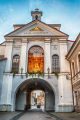 Vilnius, Lithuania: the Gate of Dawn, Lithuanian Ausros, Medininku vartai, Polish Ostra Brama, a city gate of Vilnius, one of its most important historical, cultural and religious monuments in sunrise