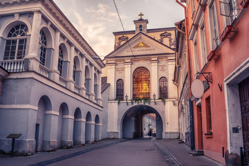 Vilnius, Lithuania: the Gate of Dawn, Lithuanian Ausros, Medininku vartai, Polish Ostra Brama, a city gate of Vilnius, one of its most important historical, cultural and religious monuments in sunrise