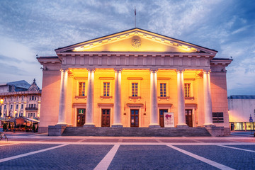 Fototapeta na wymiar Vilnius, Lithuania: the Town Hall, Lithuanian Vilniaus rotuse, in the square of the same name in the sunrise