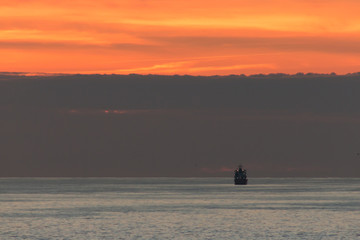 Boat silhouete in three layers