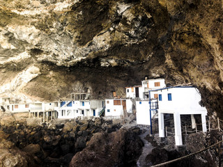 Hidden houses in a cave, Poris de Candelaria near Tijarafe, 'Pirate Bay'. Village in stone.