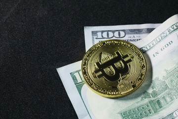 Photo bitcoin on dollar bills
