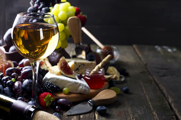 Fototapeta na wymiar Glass of white wine on picnic table.