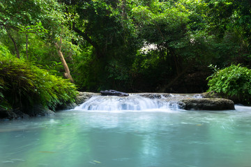 Upstream waterfall in the forest with green trees in the rainy season,Beautiful waterfall in Thailand